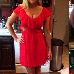 Cute red party dress with opening on both sides.